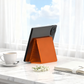 🥳🛋️✨ BEST-SELLER 2026 -50% ! Support de Téléphone Pliable en Silicone – Réglable, Antidérapant & Ultra-Mince (Noir/Orange)