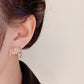 ✨🔥💎 PROMO -50% ! Boucles d'Oreilles Griffes Scintillantes – Design Étoilé, Zircon Pendante & Ajustement Confortable (Doré)