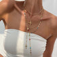 Colliers superposés avec croix dorées pour femme