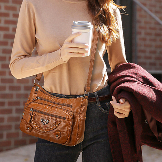 Sac bandoulière pour femme en simili cuir souple multi-poches