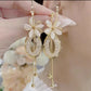 Boucles d'Oreilles Pendantes Élégantes à Fleurs et Pompons