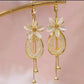 Boucles d'Oreilles Pendantes Élégantes à Fleurs et Pompons